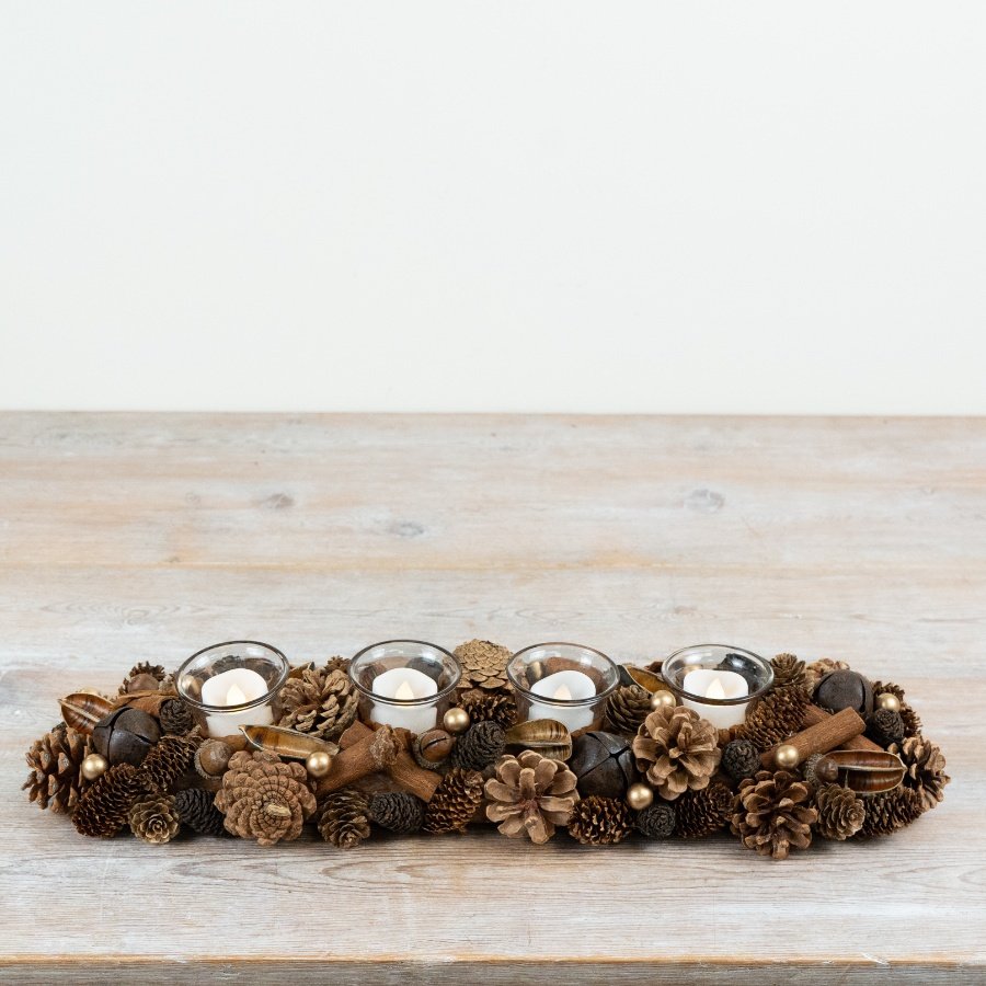 Crafted with layered pinecones, natural foliage elements and subtle decorative detailing