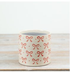 Enhance your room’s style with this elegant Bow Planter.