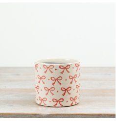 an elegant glazed cement pot in soft pink and cream