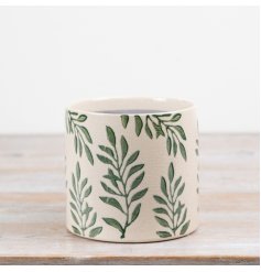 Ceramic planter features a decorative foliage pattern set against a natural cracked glaze finish. 
