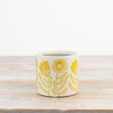 Add a cheerful touch to any space with this charming Yellow Sunflower Planter