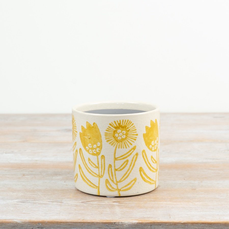 Bring warmth and joy to your home or garden with this delightful sunflower plant pot