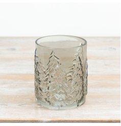 Smokey glass candle holder features embossed Christmas tree detailing that wraps around the glass