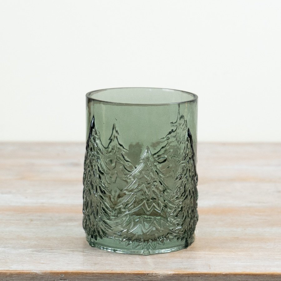 Crafted from green tinted glass with raised Christmas tree motifs encircling the design