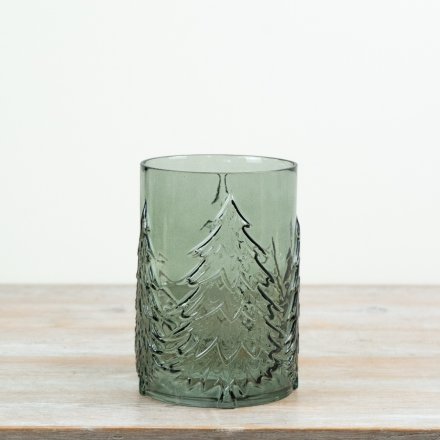 With its embossed tree pattern and rich green tone, this candle holder delivers strong visual impact in-store