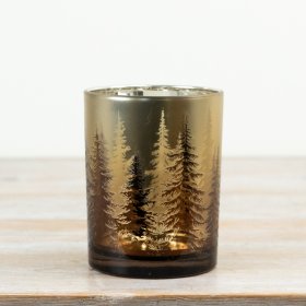 Glass tealight holder features a warm gold finish decorated with a delicate woodland tree pattern.