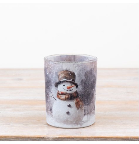 Delightful candle holder featuring a cozy winter snowman scene.