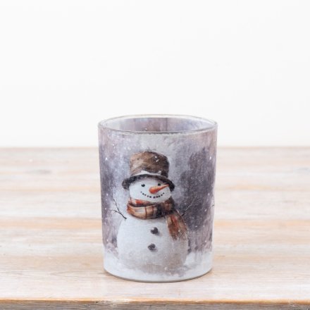 a charming winter snowman scene candle holder 