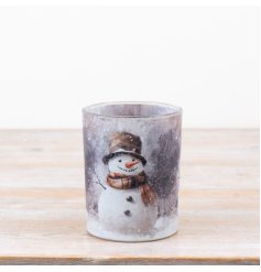 a charming winter snowman scene candle holder 