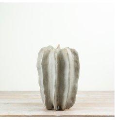 With its fluid ribbed form and understated glaze