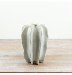 This natural stoneware vase showcases a sculptural ribbed texture for a unique, artistic look.