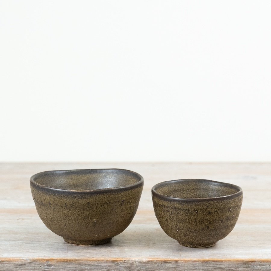 Introduce organic texture and depth to your tableware collection with this rustic ceramic bowl.