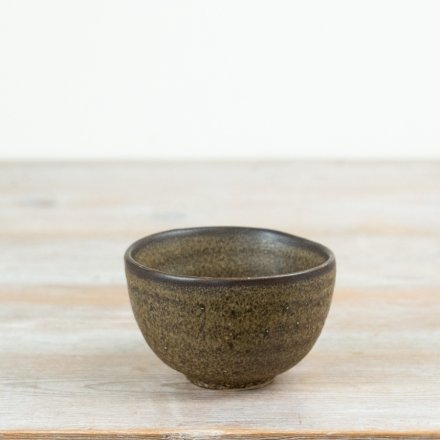 Add natural texture and charm to your tableware with this rustic, organic-inspired ceramic bowl.