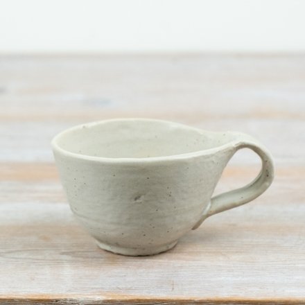 Add simple charm to daily routines with this handcrafted-inspired ceramic mug.