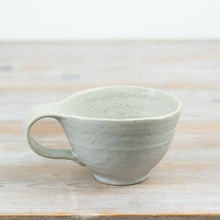 Elevate your tableware with this artisan-style ceramic mug, blending charm and effortless elegance.