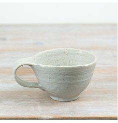 Elevate your tableware with this artisan-style ceramic mug, blending charm and effortless elegance.