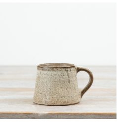 This 11.5cm ceramic mug features a beautifully textured neutral glaze with a soft speckled finish.