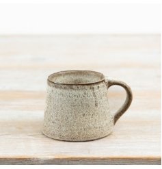 Finished in a warm neutral speckled glaze