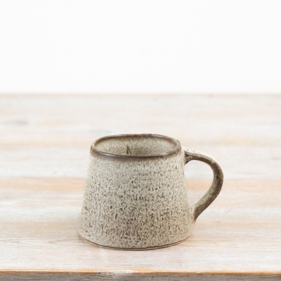 Designed with an earthy toned glaze and artisan-inspired texture,