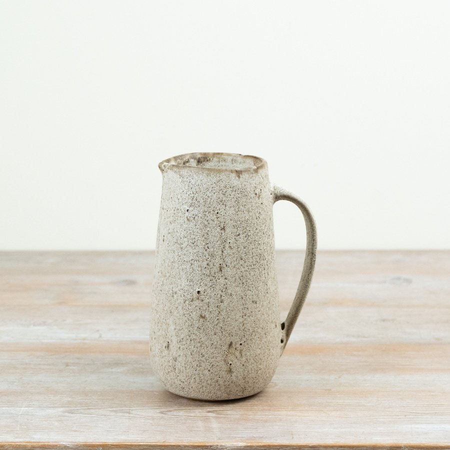 Crafted with a soft earthy tone and textured rustic finish, this 21cm ceramic jug brings timeless character to contempor