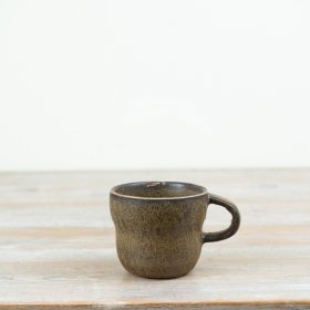 Add rustic warmth to your collection with this characterful stoneware mug.