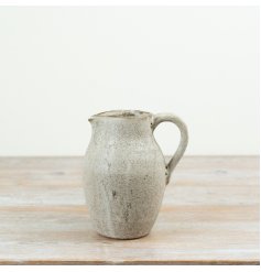 Finished in a soft neutral glaze with rustic character.