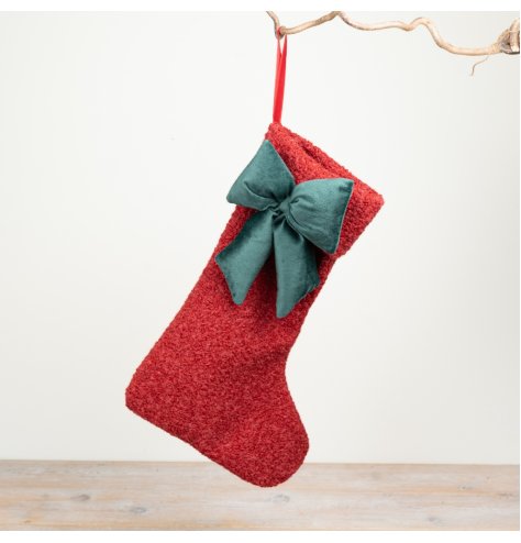 Bring warm charm to your decor with this festive, decorative Christmas stocking.