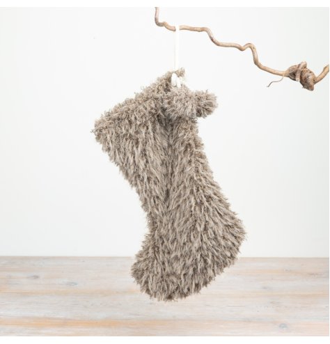 Bring warmth to your seasonal range with this plush faux fur Christmas stocking.