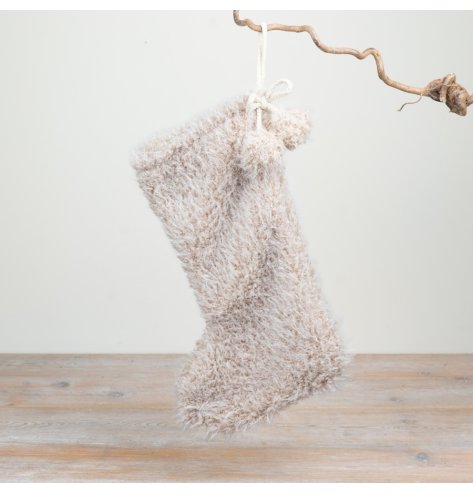 Bring warmth and comfort to your collection with this soft, plush Christmas stocking.
