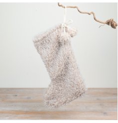 Add a soft and cosy touch to festive interiors with this plush Christmas stocking.