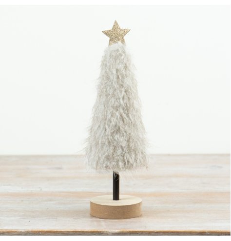 A tall and eye-catching Christmas tree decoration featuring a soft fluffy neutral finish