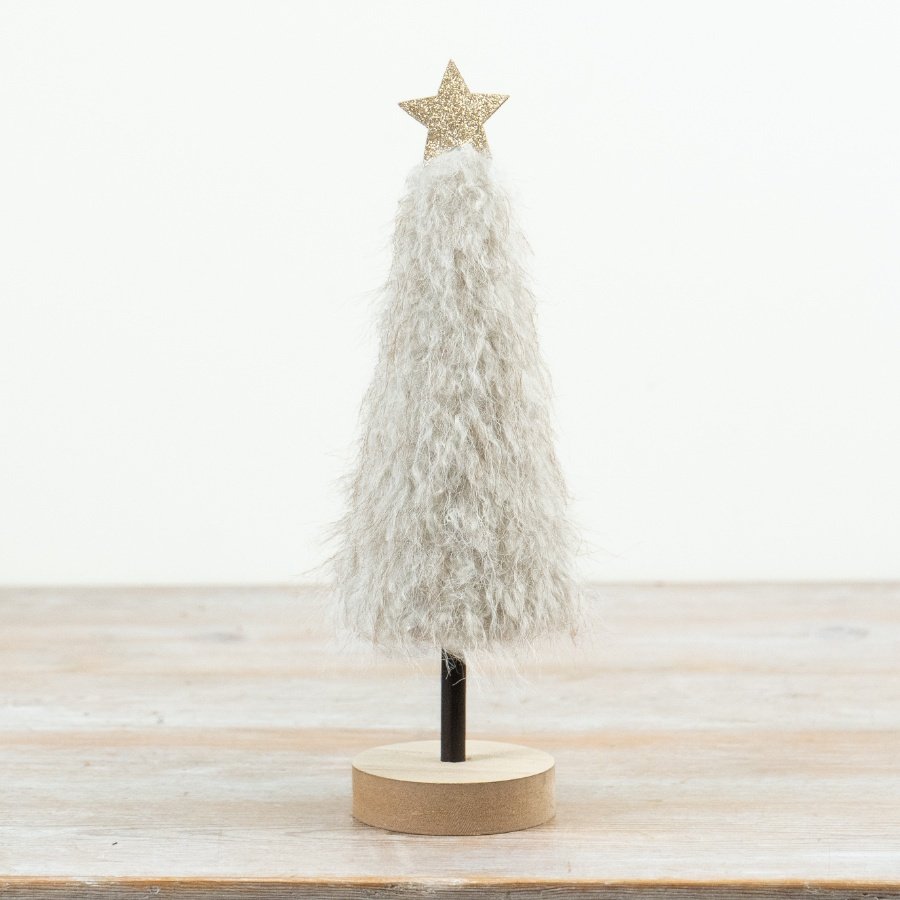 Combining soft textured detailing with a minimalist wooden base