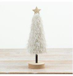 This 33cm decorative tree showcases a plush neutral finish complemented by a wooden base and subtle star detail