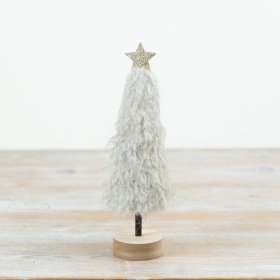 Blending textured softness with a minimalist wooden base