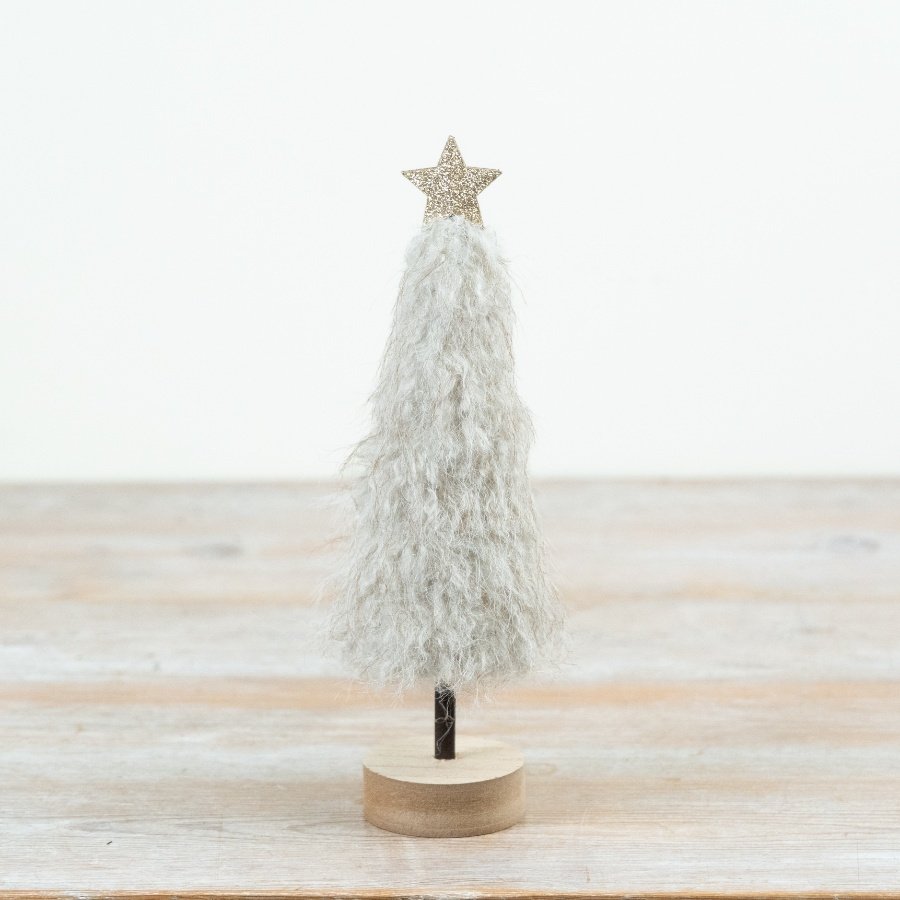 Blending textured softness with a minimalist wooden base