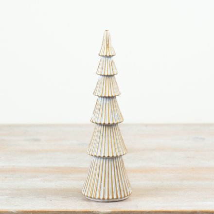 A decorative polyresin tree ornament featuring a whitewash finish with gold trim detailing.