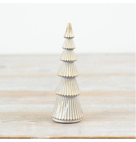 A festive polyresin tree decoration with a whitewash finish and gold trim detailing.