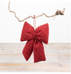 This 24cm bow features textured bouclé fabric in a vibrant red shade for a stylish decorative touch.