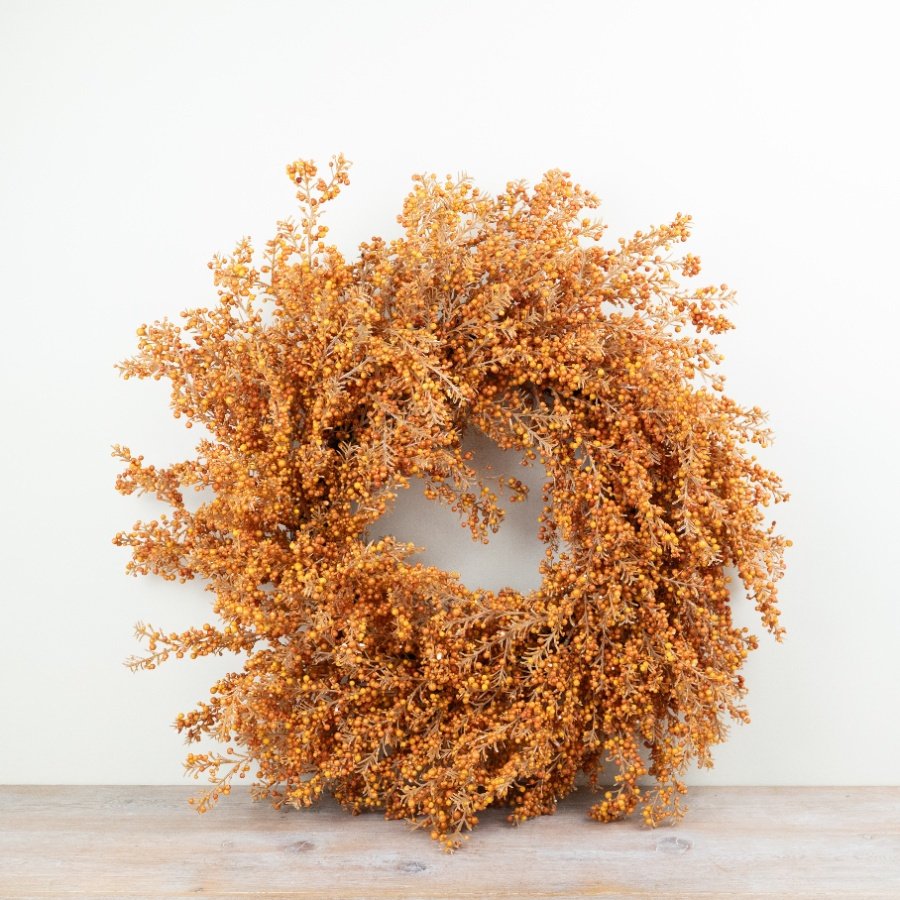 Designed with layered branches and dense berry detailing