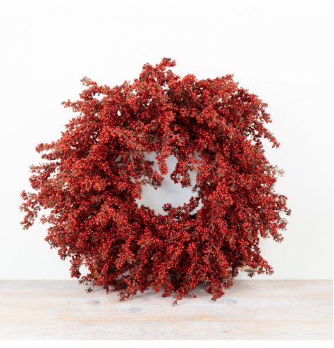 Make a festive impact with this stunning artificial red berry wreath.