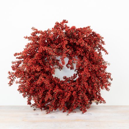 Make a festive impact with this stunning artificial red berry wreath.