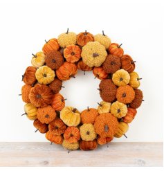 Chic autumn pumpkin wreath for seasonal decor.