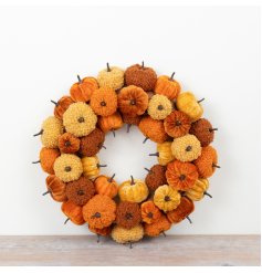 Welcome fall with this cozy pumpkin wreath, showcasing rich orange, yellow