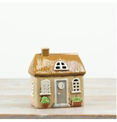 With its textured roof, arched windows and quaint cottage styling