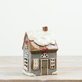 This charming Candle House brings a warm, cozy glow to brighten up any room.