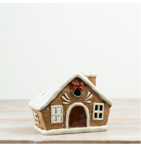 Cute tea light candle holder shaped like a cozy little house.