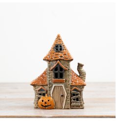 A haunted house candle for a spooky, eerie atmosphere.