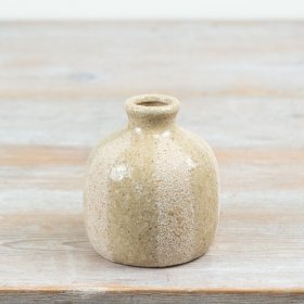 Bring natural charm to your decor with this ceramic vase featuring a stripped,