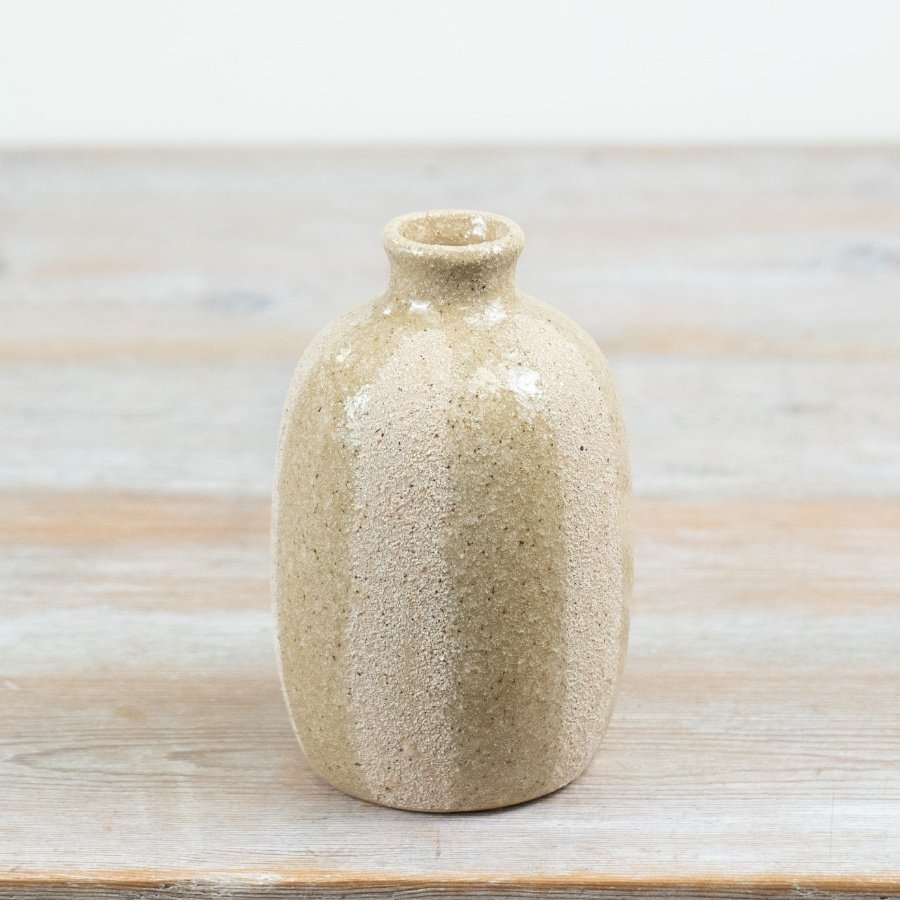 A beautiful vase with a glossy striped finish.