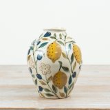 Brighten your space with this charming yellow ceramic lemon vase